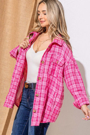 Model wearing a pink tweed button-down jacket, showcasing its stylish design and comfortable fit.