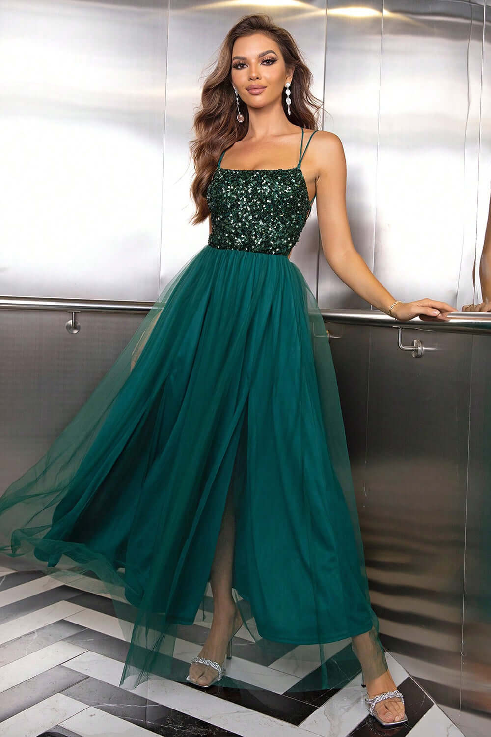 Stunning green lace-up backless mesh dress with a sequined bodice and flowing tulle skirt, perfect for special occasions.