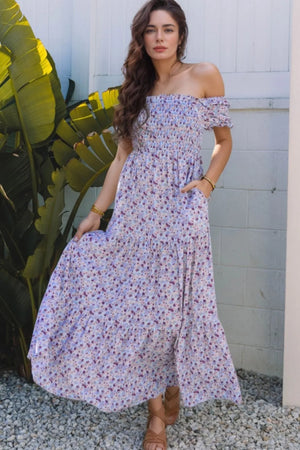 Tiered floral shirred high-waist maxi dress with off-shoulder design, perfect for summer outings.