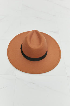 Tan fedora hat with black ribbon band, stylish and chic, perfect for enhancing any outfit.