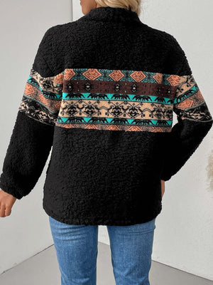 Back view of a cozy black fleece sweatshirt with multicolor geometric stripes.