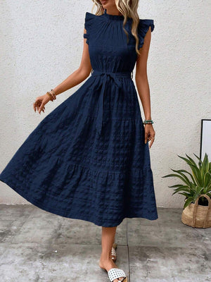 Tied ruffled cap sleeve midi dress in navy blue, featuring a tiered design and a flattering silhouette.
