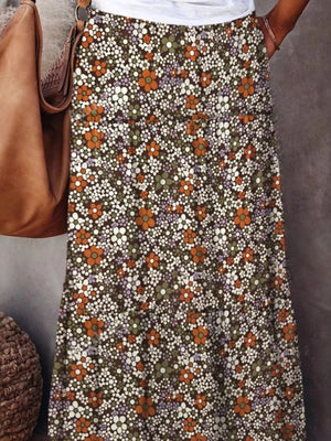 Floral print maxi skirt featuring vibrant blooms in earthy tones, perfect for casual summer outings.