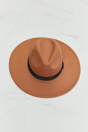 Tan fedora hat with black ribbon band, showcasing classic style and comfortable design suitable for various head sizes.