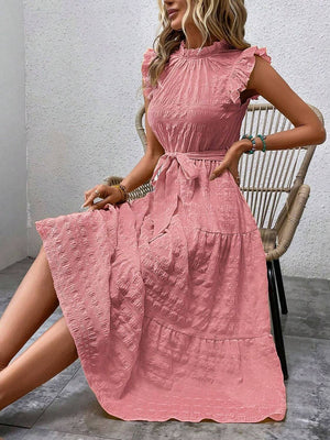 Tied ruffled cap sleeve midi dress in pink, featuring a flowy design and sheer material, displayed elegantly on a model.