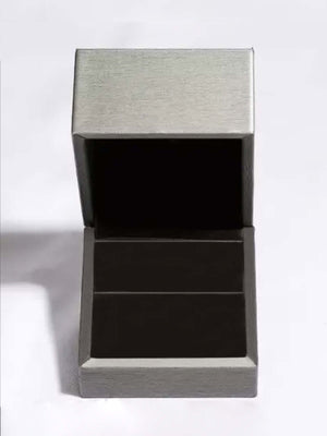 Elegant jewelry box for storing 2 carat moissanite earrings, crafted in a sleek silver design.