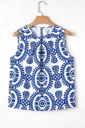 Printed crew neck sleeveless top with blue floral pattern on white background, suitable for casual wear.