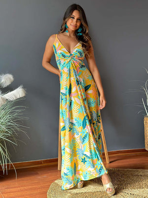 Twisted printed V-neck cami dress in colorful floral design, perfect for summer events, featuring a flowing silhouette.