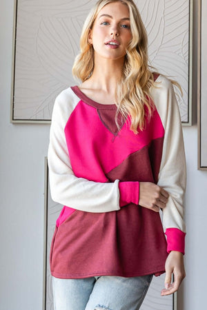 Model showcasing HOPELY color block long sleeve T-shirt in pink, burgundy, and cream for a stylish casual look.
