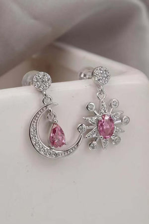 2 carat Moissanite 925 sterling silver earrings featuring a moon and star design with pink accents.