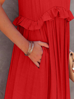 Close-up of a hand reaching into the pocket of a ruffled sleeveless tiered maxi dress in a vibrant red hue.