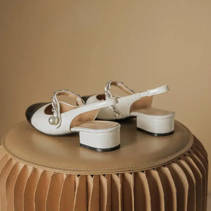 Stylish contrast block heel Mary Jane shoes with elegant pearl detail, featuring a comfortable low heel.