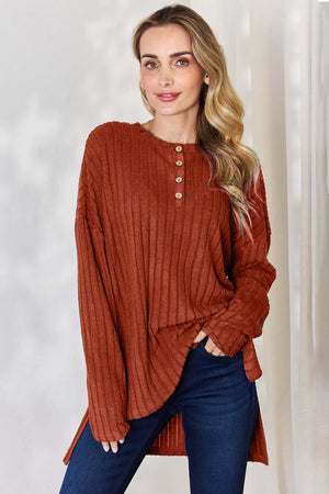 Basic Bae ribbed long sleeve high-low t-shirt in rust with half buttons, styled with denim jeans.