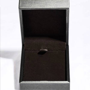 Open black jewelry box showcasing a velvet interior for displaying necklaces or other fine jewelry.
