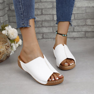 Stylish white PU leather open toe sandals with low heel, perfect for warm weather outings.