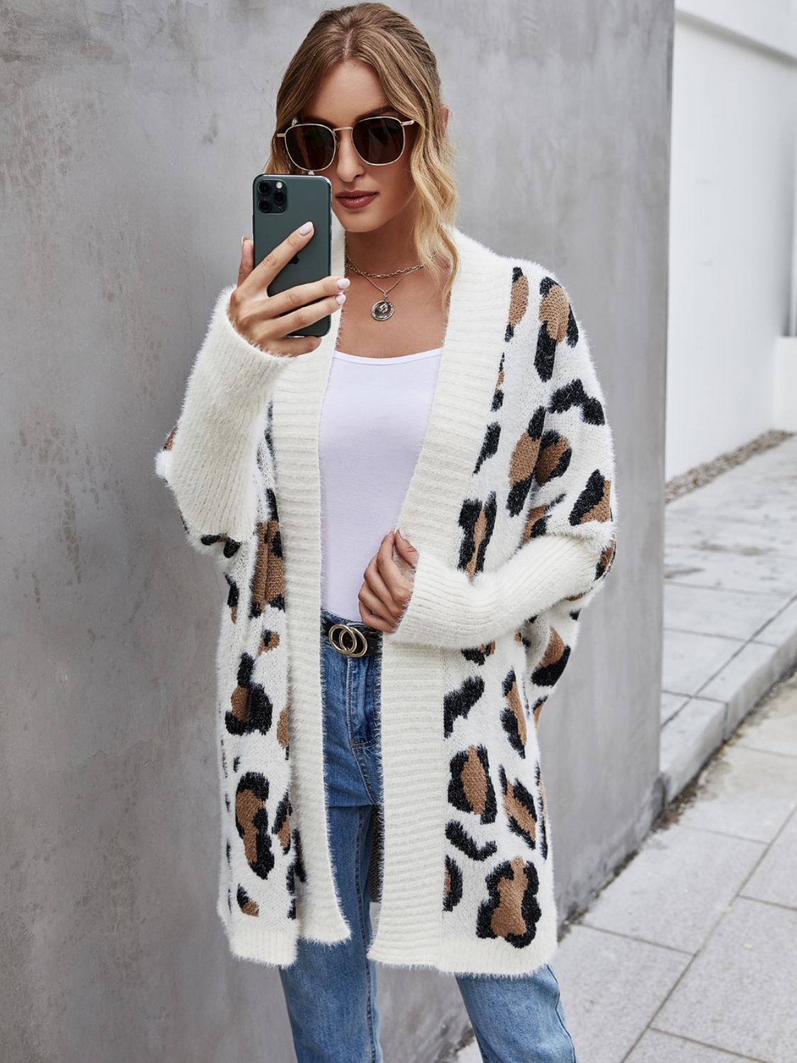 Woman wearing Angel Wings Leopard Pattern Fuzzy Cardigan, casual style with leopard print and open front, perfect for everyday wear.