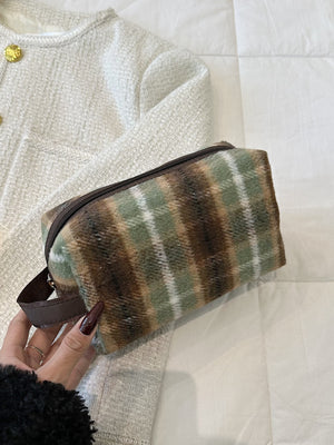 Contrast plaid clutch with zipper in green and brown, small polyester bag for stylish storage on a white background.