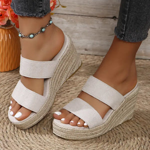 Open toe platform wedge sandals in beige with two straps, showcasing stylish design and mid heel height.