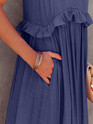 Close-up of ruffled sleeveless maxi dress with pocket, showcasing stylish fabric and elegant detail.