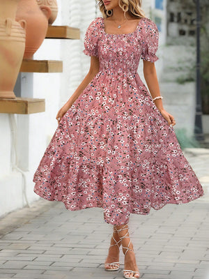Floral square neck short sleeve tiered dress in pink with floral prints, perfect for summer outings. Machine washable.