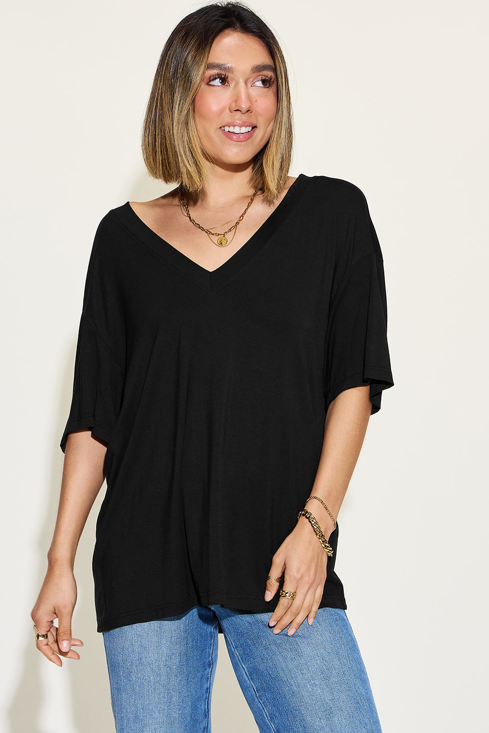 Basic Bae Full Size Bamboo V-Neck Drop Shoulder T-Shirt in black, featuring a relaxed fit and soft fabric.