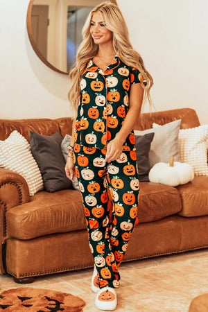 Woman in pumpkin printed short sleeve top and pants lounge set, standing on a cozy couch with autumn decor.