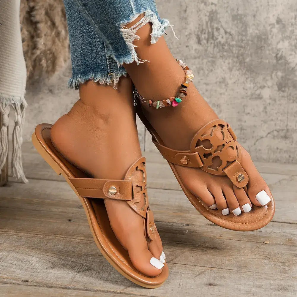 Stylish toe post flats sandals in tan color, perfect for casual summer outfits, featuring a decorative design.