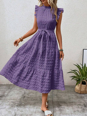 Tied ruffled cap sleeve midi dress in lavender, featuring a tiered design and a flattering silhouette.