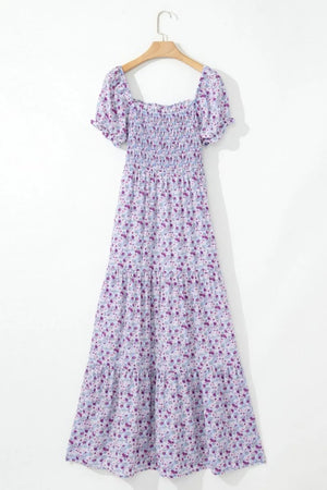 Tiered floral shirred high waist maxi dress in purple, featuring smocked bodice and flowy design, perfect for summer outings.