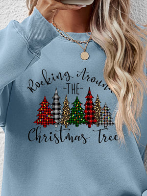 Blue sweatshirt with 'Rocking Around the Christmas Tree' graphic featuring colorful Christmas trees.