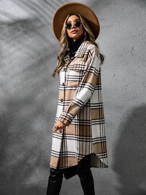 Stylish plaid collared coat with long sleeves, paired with a chic hat and sunglasses, perfect for cold weather layering.