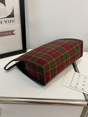Contrast plaid clutch with zipper, small polyester bag, stylish design, perfect for carrying essentials.