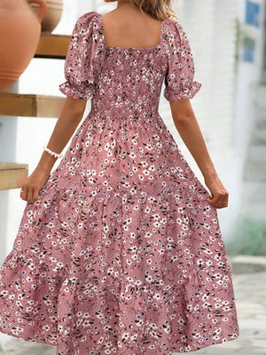 Floral square neck short sleeve tiered dress in pink with puff sleeves and a flowy silhouette, perfect for summer outings.