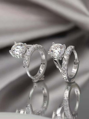 Elegant 2 carat Moissanite huggie earrings in 925 sterling silver, perfect for adding sparkle to any outfit.