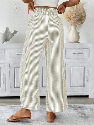 Plus size striped wide leg paper bag pants with pockets, featuring a stylish tied waistband and a relaxed fit.