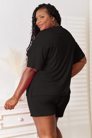 Model wearing Basic Bae black rayon half sleeve top and shorts set, showcasing a stylish and relaxed look from the back.