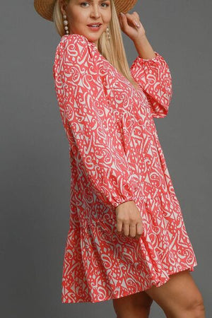 Umgee full size boho print balloon sleeve tiered dress in vibrant coral, featuring trendy balloon sleeves and a playful pattern.