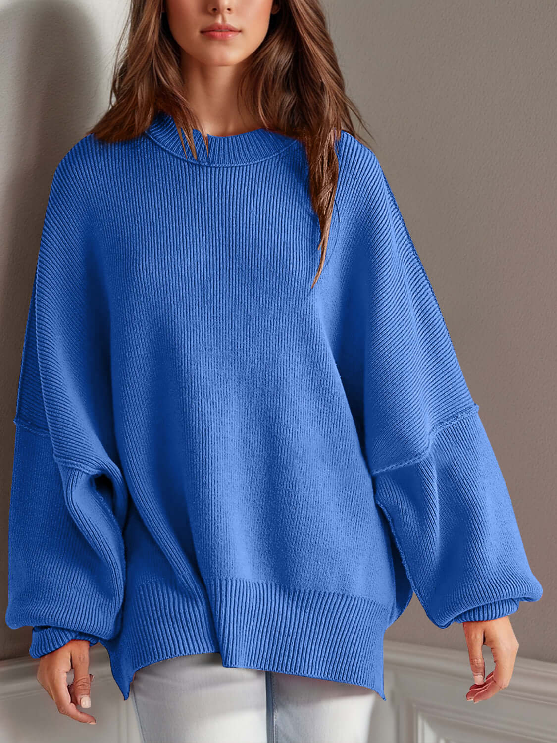 Chic side-slit sweater in vibrant blue, featuring a cozy round neck and stylish oversized fit.