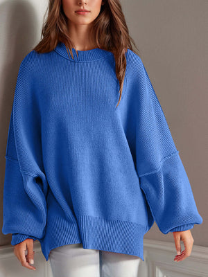 Chic side-slit sweater in vibrant blue, featuring a cozy round neck and stylish oversized fit.