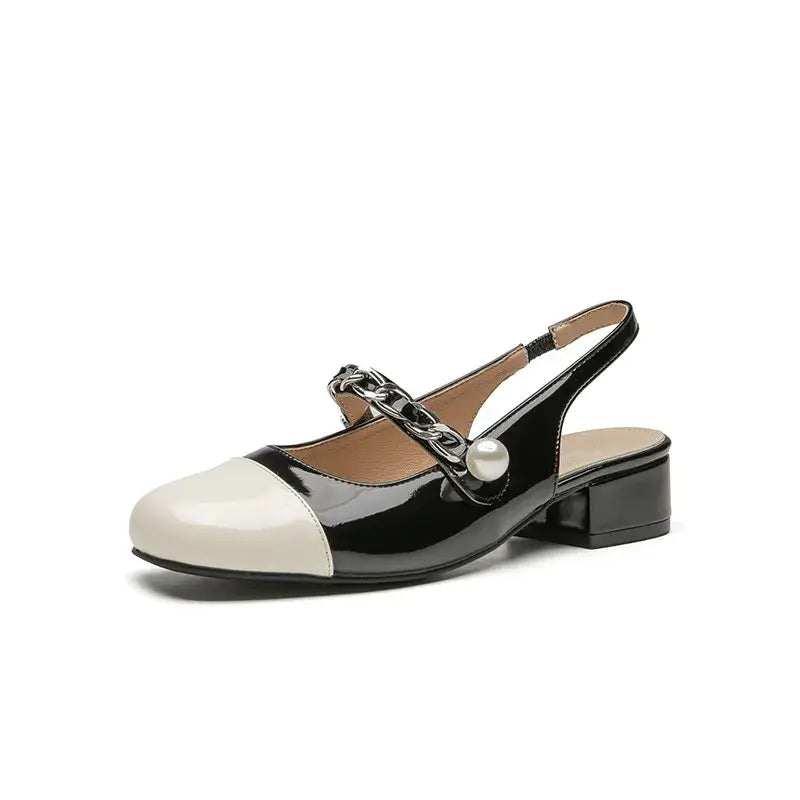 Contrast round toe block heel Mary Jane shoes with decorative chain and pearl detail in black and white.