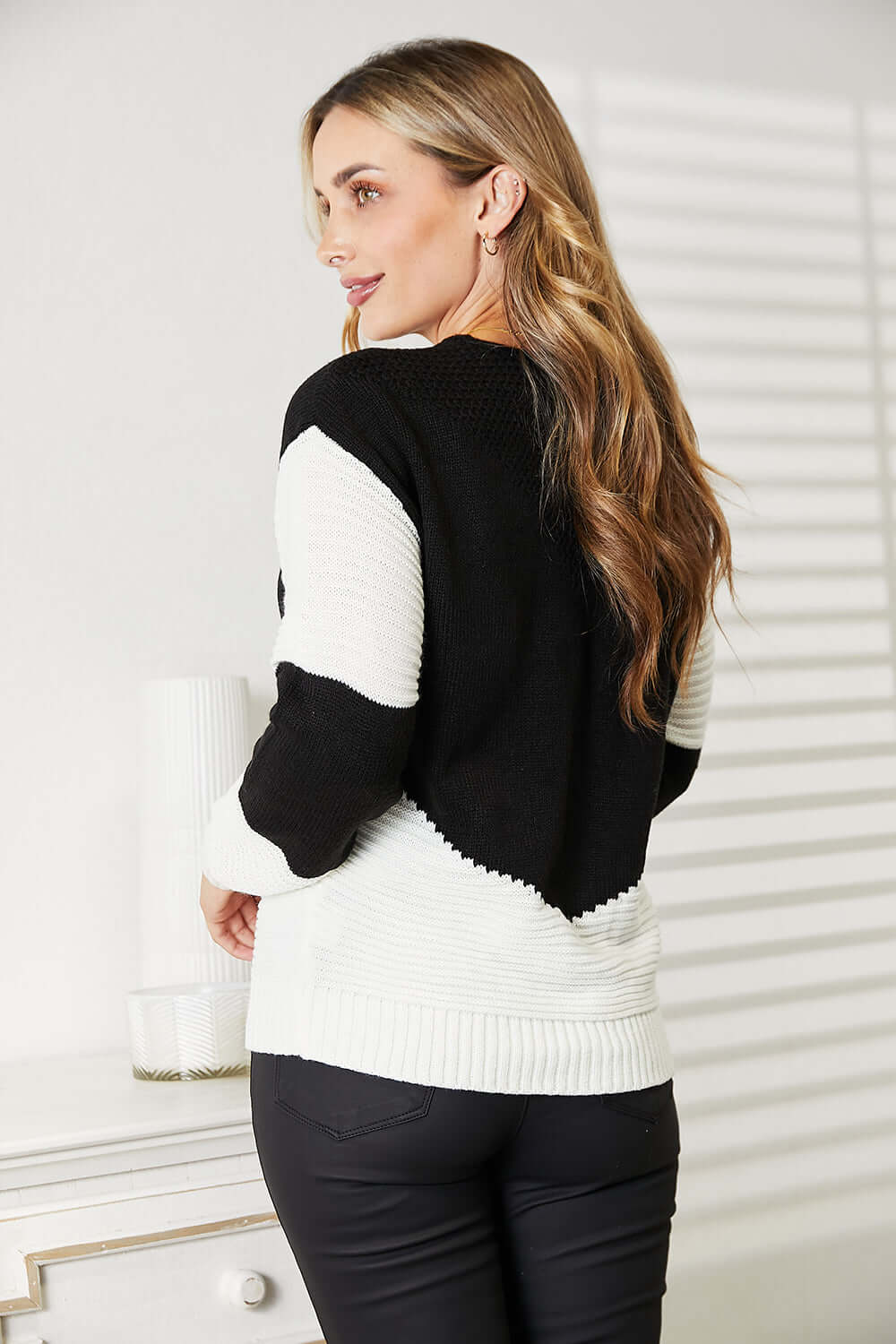 Woven Right Two-Tone Openwork Rib-Knit Sweater showcased on a model from the back, highlighting its unique design.