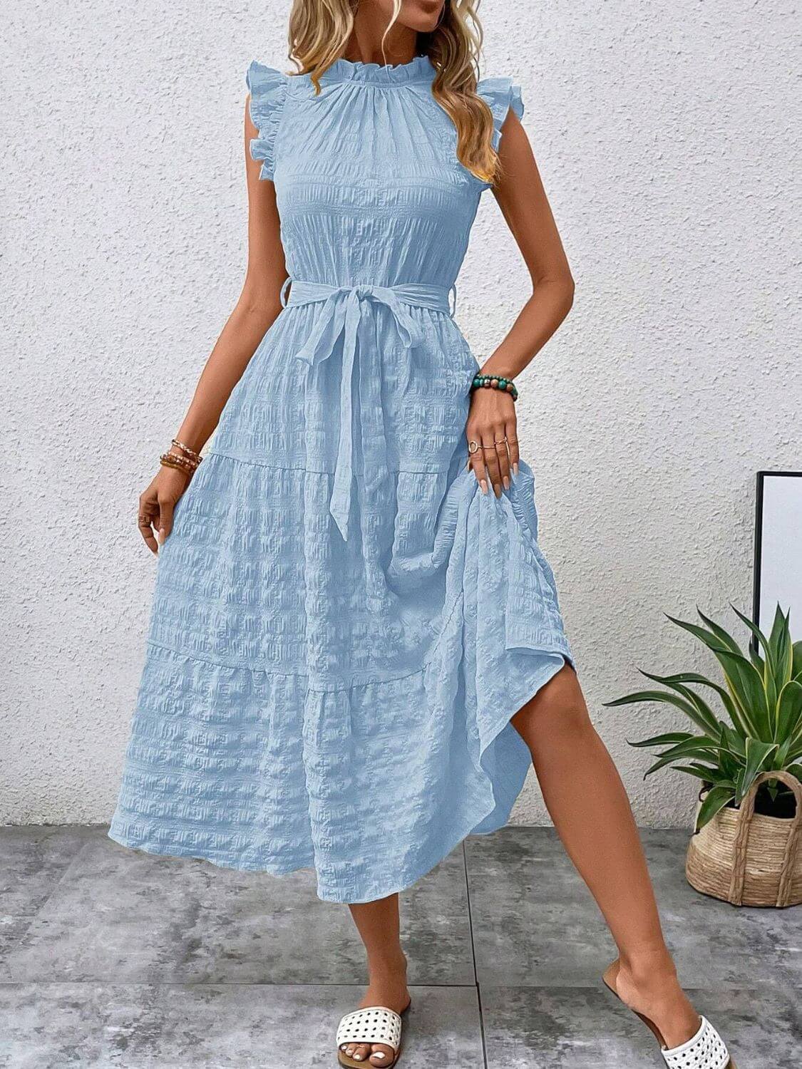 Light blue tied ruffled cap sleeve midi dress with a flowy silhouette, perfect for casual outings and summer events.