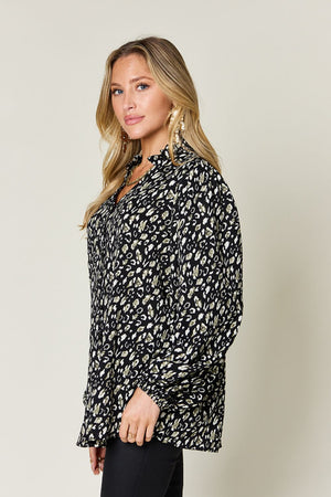 Elegant leopard print long sleeve blouse with frill detail, perfect for stylish layering.