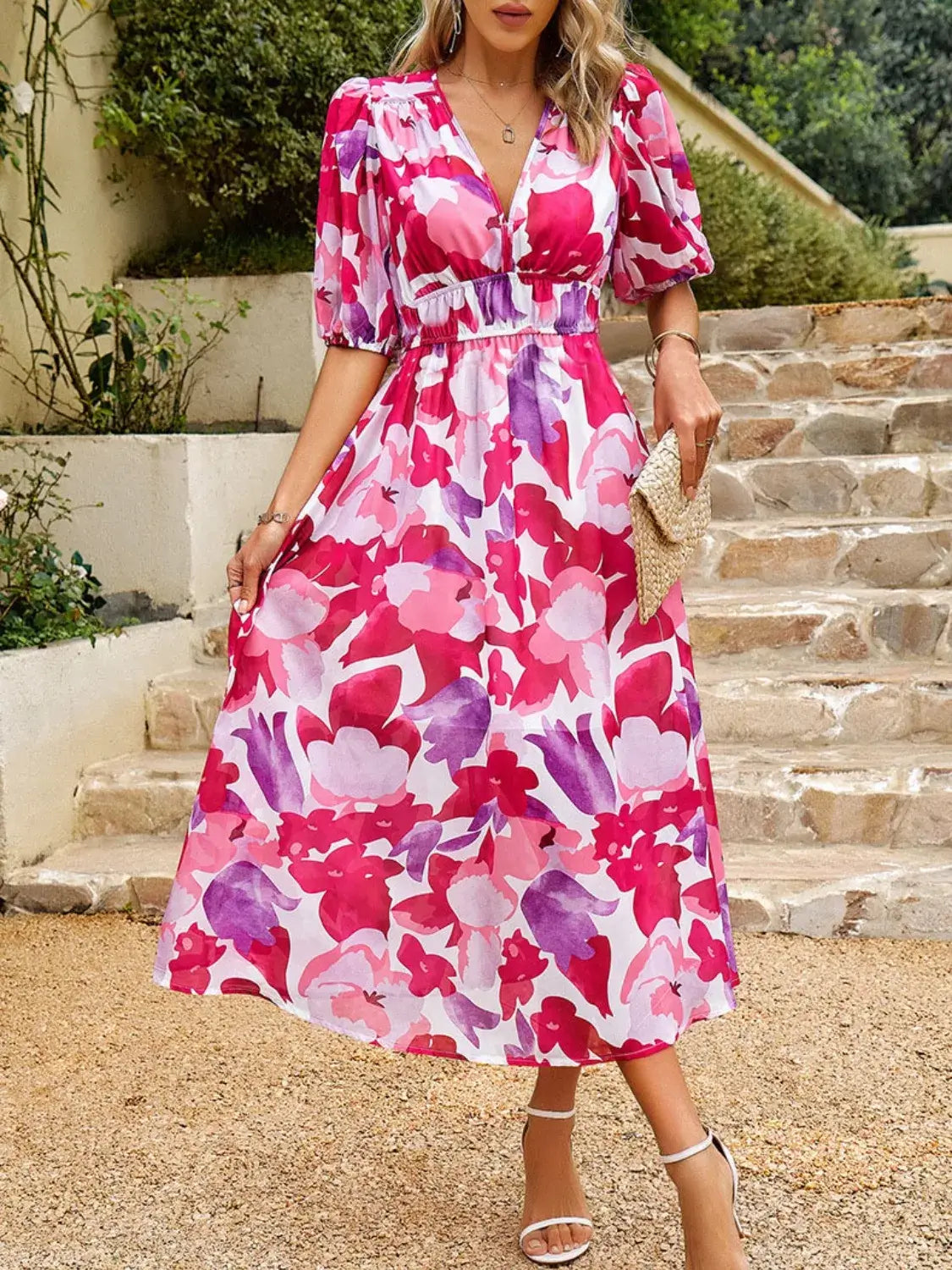 Vibrant printed puff sleeve midi dress featuring colorful floral patterns, perfect for casual outings.