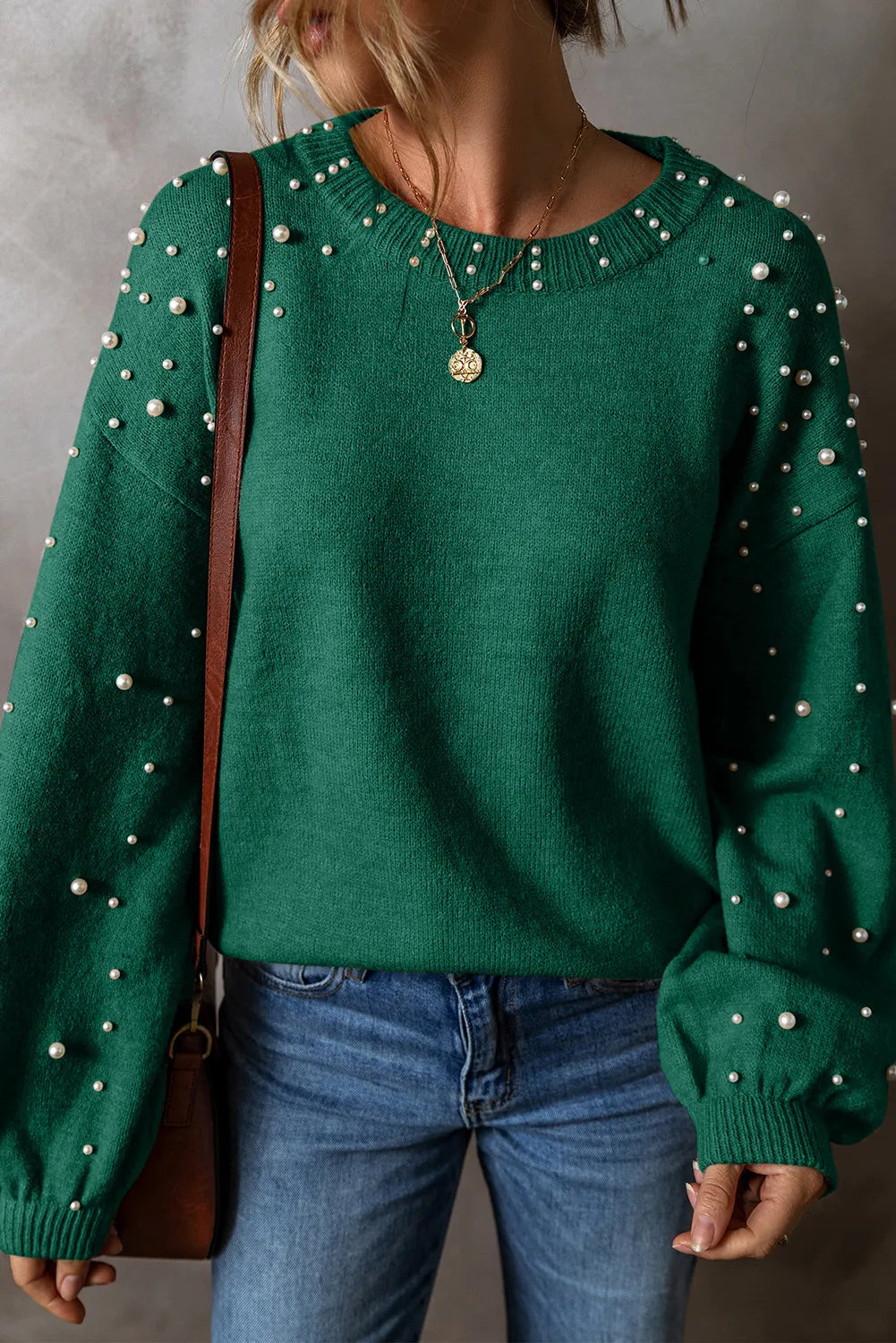 Green round neck long sleeve sweater with pearl details, perfect for casual and stylish outfits.