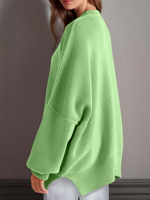 Cozy green chic side-slit sweater with round neck, perfect for stylish winter layering and comfort.