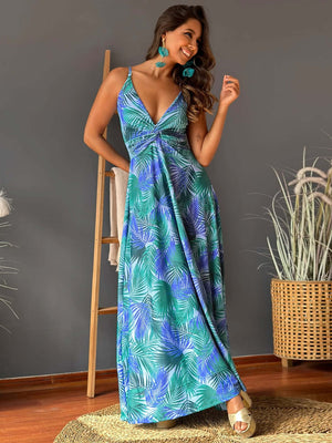 Woman wearing a Twisted Printed V-Neck Cami Dress featuring a green and blue palm leaf pattern.