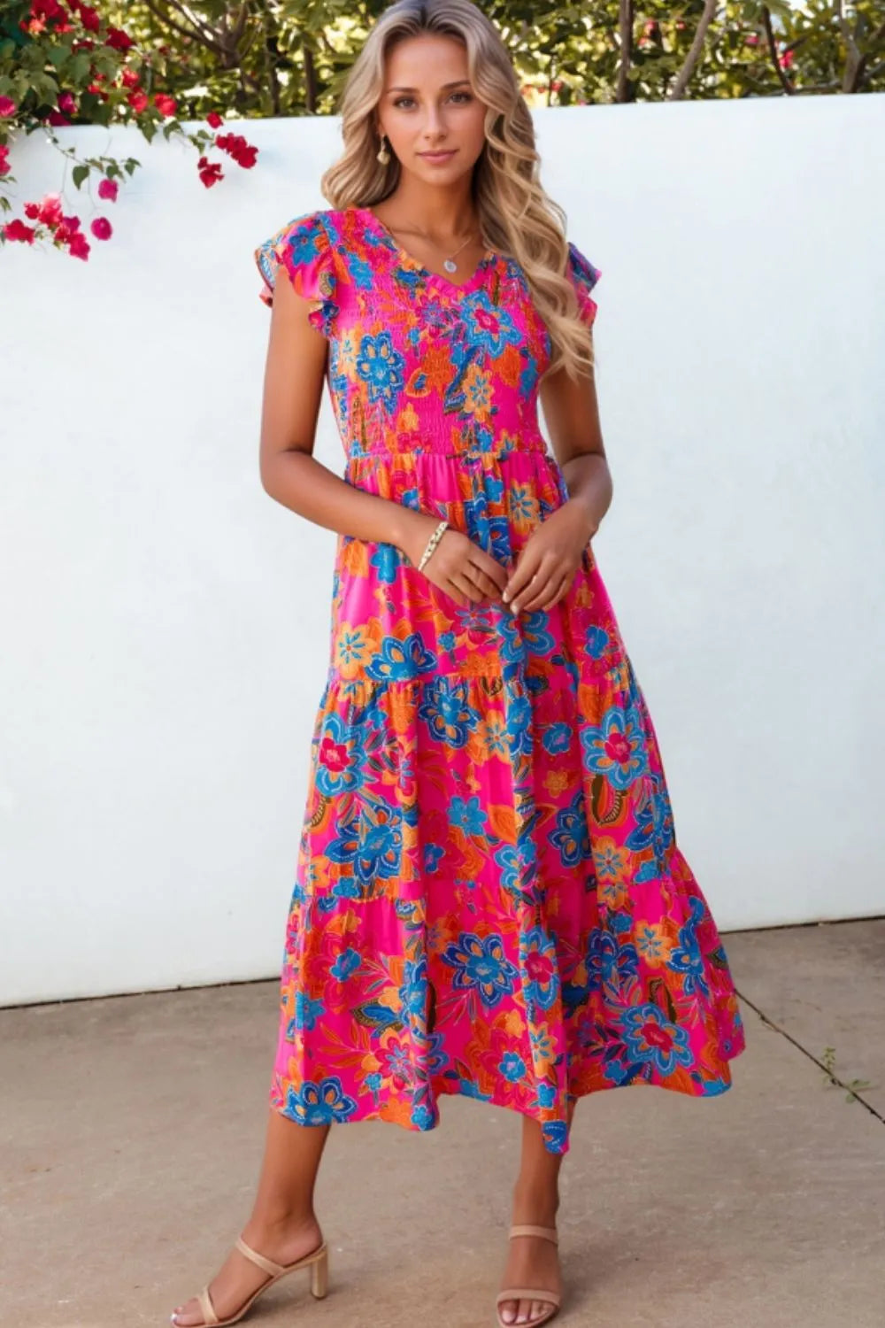 Boho floral V-neck ruffle tiered dress in vibrant colors, perfect for summer or casual outings.
