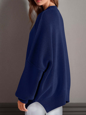 Chic navy blue side-slit sweater with cozy round neck and moderate stretch, perfect for winter fashion.