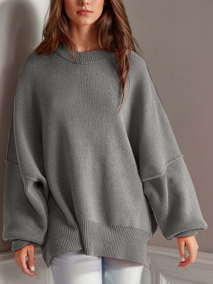 Chic side-slit sweater in gray, cozy round neck design perfect for winter fashion.